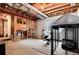 Unfinished basement space with exposed beams and a window providing natural light at 7844 Grady Cir, Castle Rock, CO 80108