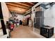 Unfinished basement area with visible pipes, a water heater, and storage items at 7844 Grady Cir, Castle Rock, CO 80108