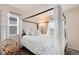 Bedroom with a four-poster bed, with a neutral color palette at 7844 Grady Cir, Castle Rock, CO 80108