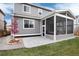 Back of a home featuring a covered patio, yard, and gray siding at 7844 Grady Cir, Castle Rock, CO 80108