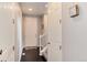 Entryway with a white door, dark floors, staircase and neutral paint at 7844 Grady Cir, Castle Rock, CO 80108