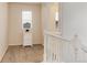 Cozy landing area with carpet, a window, and a white cabinet with drawers at 7844 Grady Cir, Castle Rock, CO 80108