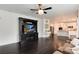 Spacious living room showcasing an entertainment center and a modern kitchen with stainless steel appliances at 7844 Grady Cir, Castle Rock, CO 80108
