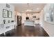 Open-concept living space showcasing a modern kitchen with a center island and stainless steel appliances at 7844 Grady Cir, Castle Rock, CO 80108