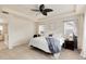 Spacious main bedroom with tray ceilings, a ceiling fan, and plush carpet, perfect for relaxation at 7844 Grady Cir, Castle Rock, CO 80108