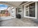 Covered patio with a barbecue grill, stamped concrete, and open views of the yard at 7844 Grady Cir, Castle Rock, CO 80108