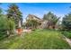 Spacious backyard with a stone patio perfect for outdoor dining and relaxation at 16309 Hedgeway Dr, Parker, CO 80134