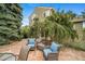 Cozy backyard patio offers comfortable seating, beautiful stone, and a serene outdoor space at 16309 Hedgeway Dr, Parker, CO 80134