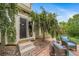 Back patio and seating offers comfortable seating, mature trees, and a serene outdoor space at 16309 Hedgeway Dr, Parker, CO 80134