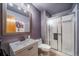 Modern bathroom featuring a vanity, toilet, and a glass-enclosed shower at 16309 Hedgeway Dr, Parker, CO 80134