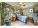 Comfortable bedroom with a cozy bed, ample natural light, and stylish décor at 16309 Hedgeway Dr, Parker, CO 80134