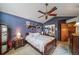 Inviting bedroom with decorative shelves, bedside tables, and vaulted ceiling at 16309 Hedgeway Dr, Parker, CO 80134