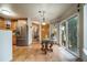 Bright dining area that includes stainless steel refrigerator and access to the back patio at 16309 Hedgeway Dr, Parker, CO 80134