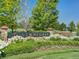 Stonegate community sign surrounded by beautiful flowers and green grass at 16309 Hedgeway Dr, Parker, CO 80134