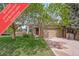 Charming home with a well-maintained lawn, mature trees, and a convenient two-car garage at 16309 Hedgeway Dr, Parker, CO 80134