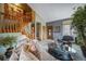 Inviting living room featuring a staircase, stylish furniture, and a large front door entrance at 16309 Hedgeway Dr, Parker, CO 80134