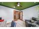Home office featuring wood trim, french doors, ceiling fan, and hardwood floors at 16309 Hedgeway Dr, Parker, CO 80134
