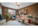 Charming home office with built-in shelving, natural light, and comfortable seating at 16309 Hedgeway Dr, Parker, CO 80134