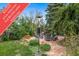 Cozy patio with seating area, surrounded by lush landscaping, and promotional offer at 16309 Hedgeway Dr, Parker, CO 80134