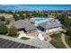 Aerial view of community pool with lounge chairs, shade structures and clubhouse at 16309 Hedgeway Dr, Parker, CO 80134