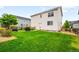 Lush backyard featuring green grass and landscaping for serene outdoor living and recreation at 12845 Park Creek Way Way, Firestone, CO 80504