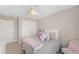 Bright bedroom with plush bedding, decorative pillows, and ample closet space at 12845 Park Creek Way Way, Firestone, CO 80504