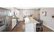 Stylish kitchen features stainless steel appliances, sleek cabinets, large island with seating at 12845 Park Creek Way Way, Firestone, CO 80504