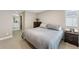 Serene main bedroom with plush bedding, a walk in closet and access to an en-suite bathroom at 12845 Park Creek Way Way, Firestone, CO 80504