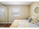 Cozy bedroom with mirrored closet doors, hardwood floors, and natural light at 190 S Canosa Ct, Denver, CO 80219