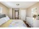 Bright bedroom features neutral walls, hardwood floors, and a large white dresser at 190 S Canosa Ct, Denver, CO 80219