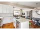Open-concept kitchen with a large island, stainless steel appliances, and stylish finishes at 190 S Canosa Ct, Denver, CO 80219