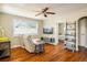 Bright living room featuring hardwood floors, a ceiling fan, and a comfortable recliner at 190 S Canosa Ct, Denver, CO 80219