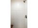 Modern shower with decorative white tiled walls and updated shower head at 190 S Canosa Ct, Denver, CO 80219