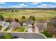Aerial view of the neighborhood with a home featuring a front yard and a view of the park at 6340 E Costilla Pl, Centennial, CO 80112