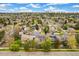 High angle aerial view featuring a residential neighborhood with tree lined streets and well maintained homes at 6340 E Costilla Pl, Centennial, CO 80112