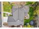 Aerial view of a house showing the roof, backyard with a fire pit and seating, and a trampoline at 6340 E Costilla Pl, Centennial, CO 80112