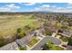 Stunning aerial view showcasing the neighborhood and surrounding green spaces, with mountains visible in the distance at 6340 E Costilla Pl, Centennial, CO 80112