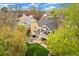 Aerial view of a lovely backyard with a seating area, fire pit, lawn, and balcony at 6340 E Costilla Pl, Centennial, CO 80112