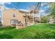 Spacious backyard with a patio, fire pit, and lush green lawn, perfect for outdoor entertaining at 6340 E Costilla Pl, Centennial, CO 80112