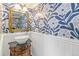 Charming powder room with floral wallpaper, elegant vanity, and stylish fixtures, adding a touch of sophistication at 6340 E Costilla Pl, Centennial, CO 80112