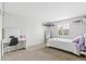 Minimalist bedroom with neutral tones, vanity, and natural light, creating a serene and inviting atmosphere at 6340 E Costilla Pl, Centennial, CO 80112