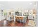 Bright and airy kitchen featuring a large island, modern lighting, and seamless flow to the dining space at 6340 E Costilla Pl, Centennial, CO 80112