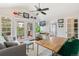 Cozy living room with vaulted ceiling, French doors to balcony, and a view to bathroom at 6340 E Costilla Pl, Centennial, CO 80112