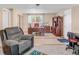 Finished basement area with an office setup and comfortable seating at 3914 E 116Th Pl, Thornton, CO 80233