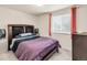 Bedroom with cozy decor, window and stylish accents at 3914 E 116Th Pl, Thornton, CO 80233