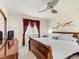 Comfortable bedroom with a wood dresser, ceiling fan, and natural light, a restful retreat at 3914 E 116Th Pl, Thornton, CO 80233