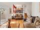 Spacious living room with an open layout, hardwood floors, and seamless transition to other areas of the home at 3914 E 116Th Pl, Thornton, CO 80233