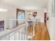 Open floor plan with hardwood floors, white trim, and arched entryway to the dining room at 3914 E 116Th Pl, Thornton, CO 80233
