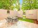 Enclosed patio with an arched gateway and a dining table at 3914 E 116Th Pl, Thornton, CO 80233