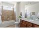 Full bathroom with tub, shower, vanity and large mirror at 19834 W 56Th Pl, Golden, CO 80403